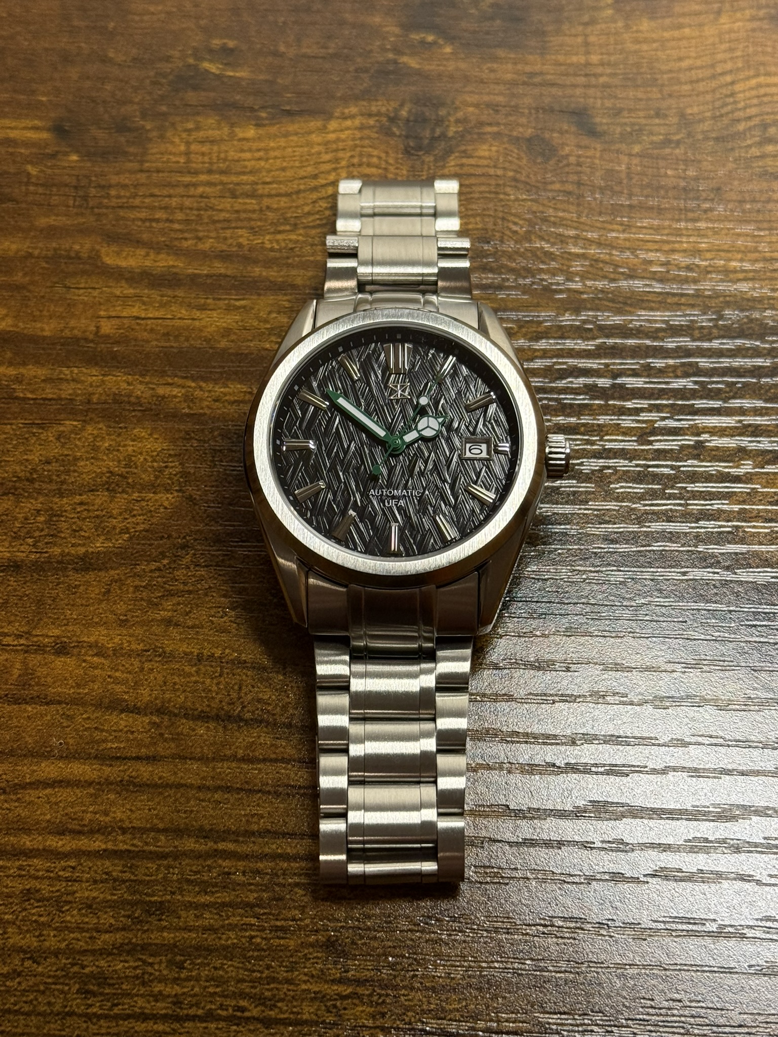 Trix automatic with herringbone dial on a steel bracelet