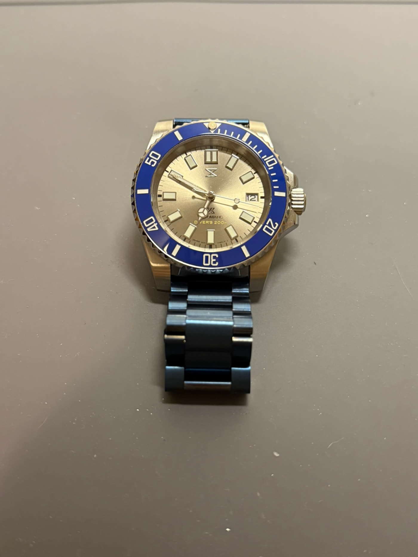 Diver with blue bezel, raised three-quarter view